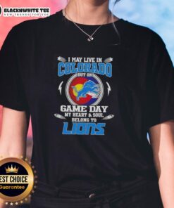 Colorado ladies tee showcasing Detroit Lions pride with text: 'I May Live In Colorado But My Heart Belongs To Detroit Lions.'