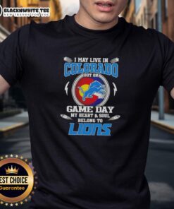 Alt Text: I May Live In Colorado But On Game Day My Heart Belongs To Detroit Lions T-Shirt design in vibrant blue and gold.