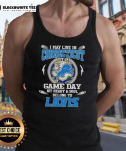 Woman wearing 'I May Live In Connecticut But On Game Day My Heart Belongs To Detroit Lions' tank top, showing team spirit.