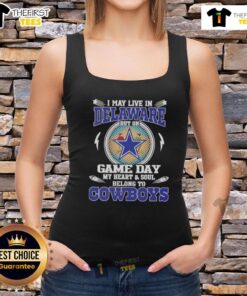 Woman wearing a Dallas Cowboys football tank top, showcasing her team spirit while living in Delaware on game day.