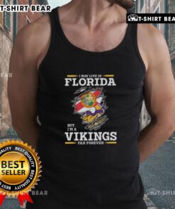 Tank top with 'I May Live In Florida But I'm A Minnesota Vikings Fan Forever' design, perfect for NFL fans.