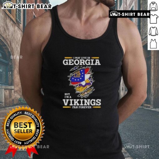 Original 'I May Live In Georgia But I'm A Minnesota Vikings Fan Forever' tank top showcasing team pride and style.