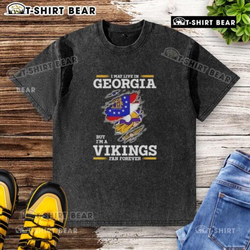Original washed t-shirt featuring 'I may live in Georgia but I'm a Minnesota Vikings fan forever' design.