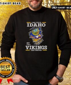 Cozy sweatshirt featuring 'I May Live In Idaho But I'm A Minnesota Vikings Fan Forever' design, perfect for Vikings fans.