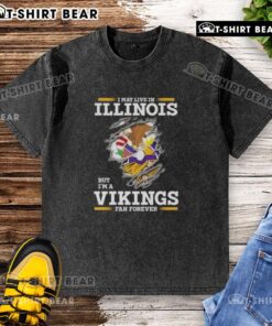Original washed t-shirt with 'I may live in Illinois, but I'm a Minnesota Vikings fan forever' design, ideal for fans.