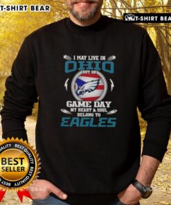 Alt Text: Cozy sweatshirt reading 'I may live in Ohio but on game day my heart belongs to Philadelphia Eagles' in green.