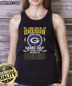 Woman wearing 'I May Live In Oregon But On Game Day My Heart Belongs To Green Bay Packers' tank top, showing team spirit.