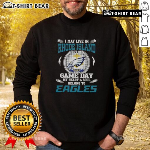 Original sweatshirt featuring 'I May Live In Rhode Island But On Game Day My Heart Belongs To Philadelphia Eagles' design.