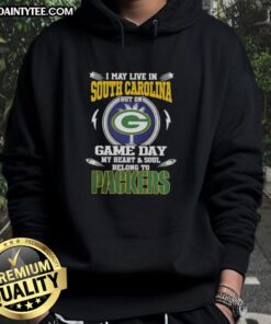Alt Text: Green Bay Packers hoodie with the phrase I May Live In South Carolina But On Game Day My Heart Belongs To displayed.