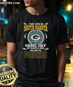 Alt Text: Green Bay Packers T-shirt with 'I May Live In South Dakota But On Game Day My Heart Belongs To Packers' design.