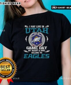 Ladies tee: 'I May Live In Utah, But On Game Day My Heart Belongs To Philadelphia Eagles,' perfect for fans.