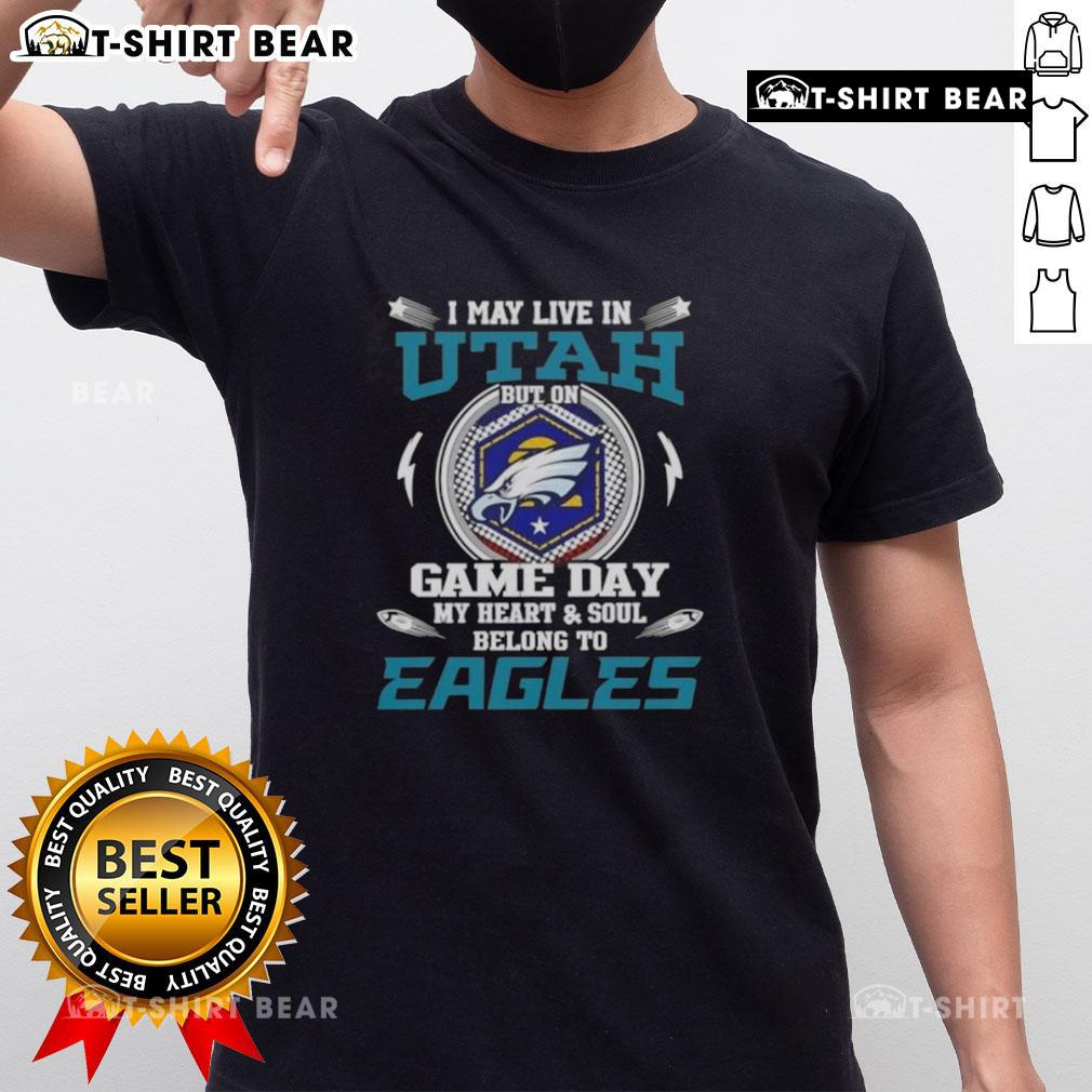 Original I May Live In Utah But On Game Day My Heart And Soul Belongs To Philadelphia Eagles T-Shirt Alt Text: I May Live In Utah But On Game Day My Heart And Soul Belongs To Philadelphia Eagles T-Shirt displayed on a hanger.