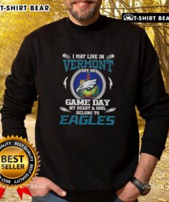 Alt Text: Cozy sweatshirt featuring I May Live In Vermont, But On Game Day My Heart Belongs To Philadelphia Eagles design.