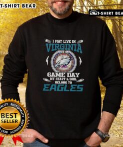 Cozy sweatshirt featuring 'I may live in Virginia, but on game day, my heart belongs to Philadelphia Eagles' design.