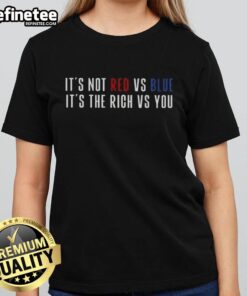 Original 'It's Not Red Vs Blue, It's The Rich Vs You' Ladies Tee showcasing a bold graphic design in vibrant colors.