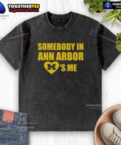 Original Michigan 'Somebody in Ann Arbor Loves Me' washed t-shirt displayed on a wooden background, perfect for casual wear.