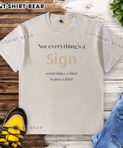 Original 'Not Everything's a Sign' bird graphic on a washed t-shirt, showcasing a humorous design for casual wear.