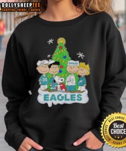 Original Peanuts characters on a Philadelphia Eagles Christmas sweatshirt, perfect for festive football fans.