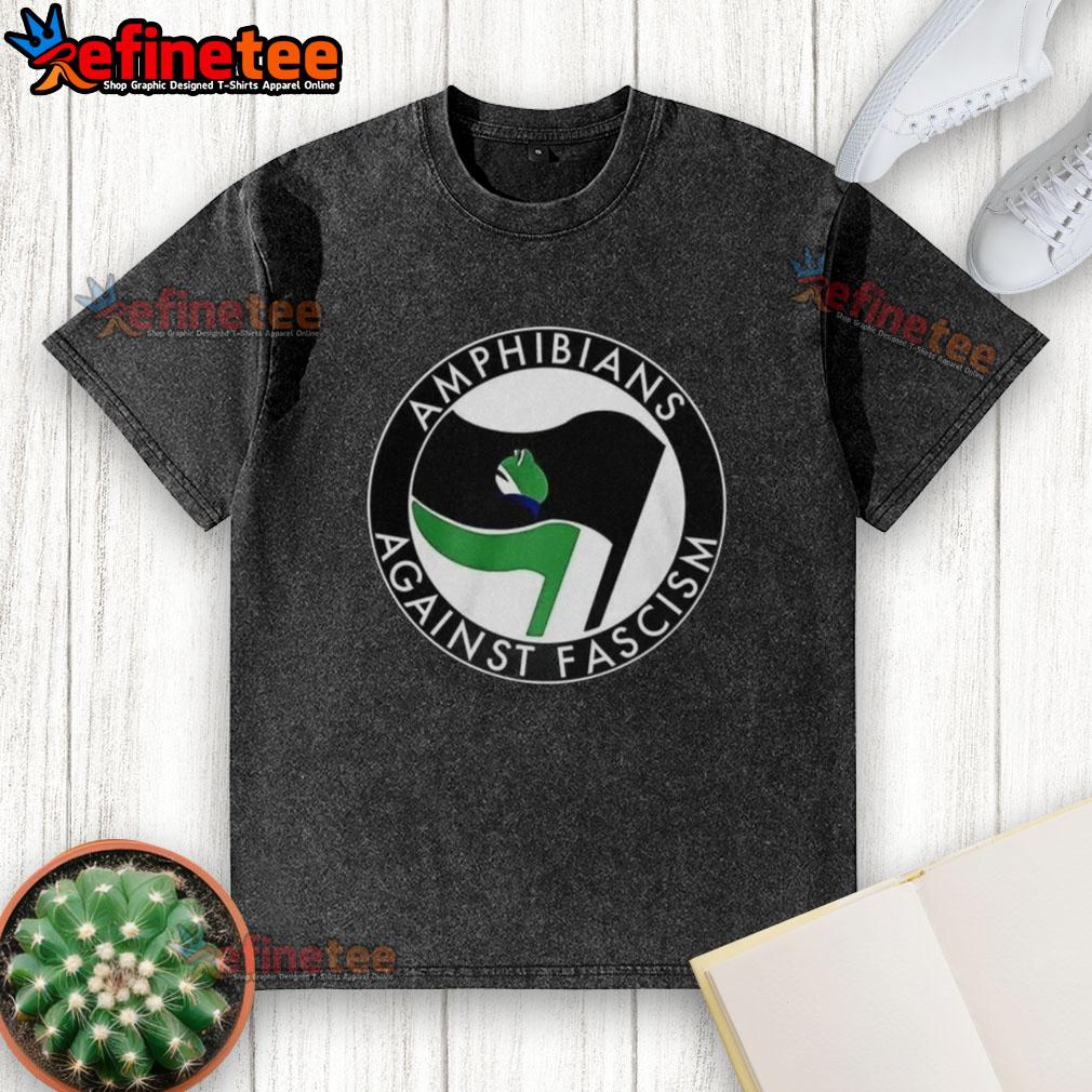 premium-amphibians-against-fascism-frog-flag-washed-t-shirt Premium Amphibians Against Fascism frog flag washed t-shirt featuring a vibrant frog design promoting anti-fascist values.