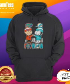 Premium Charlie Brown and Snoopy hoodie featuring Florida Gators and Miami Dolphins skyline design.