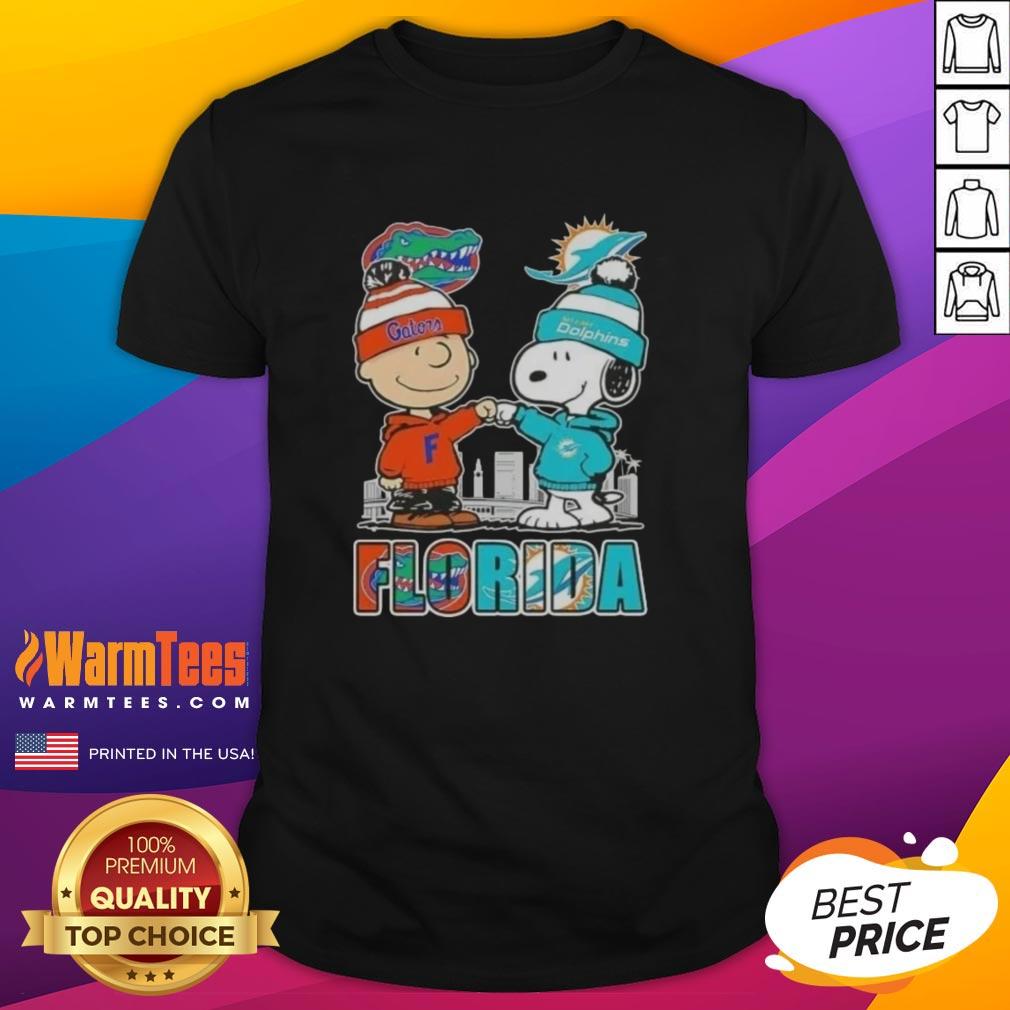 premium-charlie-brown-and-snoopy-florida-gators-and-miami-dolphins-skyline-t-shirt Premium Charlie Brown and Snoopy Florida Gators Miami Dolphins skyline t-shirt featuring iconic characters and vibrant design.