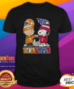 Alt Text: Premium Charlie Brown and Snoopy Tennessee Vols x Titans Skyline T-Shirt featuring iconic characters and city skyline design.