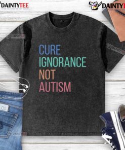 Premium Cure Ignorance Not Autism washed t-shirt in a casual setting, promoting autism awareness and acceptance.