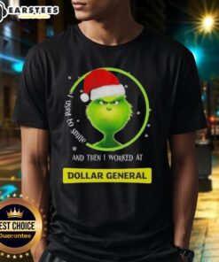 Premium Grinch Christmas T-shirt featuring 'I Used To Smile And Then I Worked At Dollar General' text design.