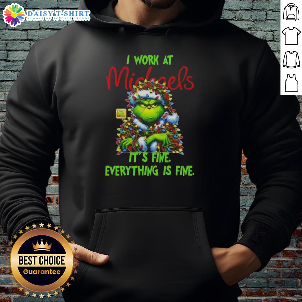 Premium Grinch Christmas Tree X Michaels I Work At It's Fine Everything Is Fine Hoodie Premium Grinch Christmas Tree hoodie from Michaels featuring 'I Work At It's Fine Everything Is Fine' design.