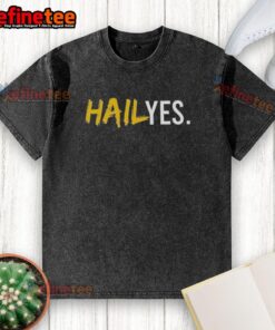 Premium Hail Yes Michigan Wolverines Football washed t-shirt featuring team logo and vibrant colors for fans.