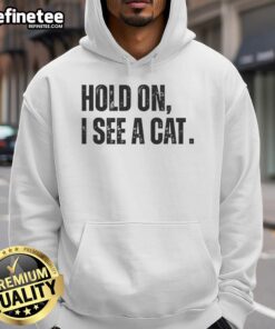 Premium Hold On I See A Cat Lover Pet Parent Humor Hoodie in cozy design, perfect for cat enthusiasts and pet lovers.