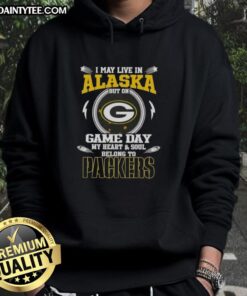 Premium hoodie featuring 'I May Live In Alaska But On Game Day My Heart And Soul Belongs To Green Bay Packers' design.