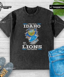 Premium washed t-shirt featuring 'I May Live In Idaho But I'm A Lions Fan Forever' design, perfect for loyal fans.
