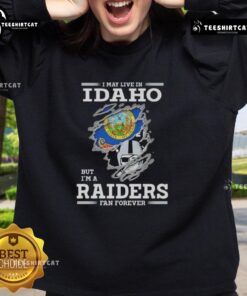Alt Text: Premium sweatshirt featuring 'I May Live In Idaho But I'm A Raiders Fan Forever' design for NFL fans.