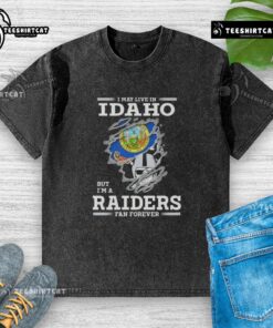 Premium washed t-shirt featuring 'I May Live In Idaho But I'm A Raiders Fan Forever' design for dedicated fans.
