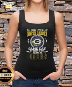 Premium tank top featuring 'I May Live In North Dakota But On Game Day My Heart Belongs To Green Bay Packers' design.