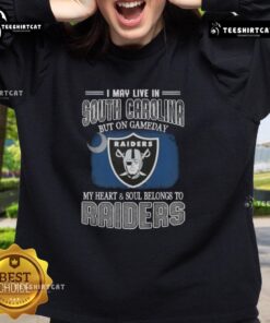 Alt Text: Premium sweatshirt featuring I May Live In South Carolina But On Gameday My Heart Belongs To Raiders design.