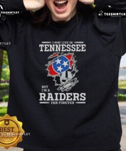 Premium sweatshirt featuring 'I May Live In Tennessee But I'm A Raiders Fan Forever' design, perfect for Raiders fans.