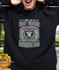 Premium sweatshirt with 'I May Live In West Virginia But On Gameday My Heart And Soul Belongs To Raiders' design.