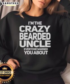 Premium I'm The Crazy Bearded Uncle Everyone Warned You About Sweatshirt in a cozy setting, showcasing fun design.
