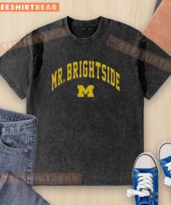 Premium Mr. Brightside Michigan Wolverines Football washed t-shirt in blue, perfect for fans showcasing team spirit.
