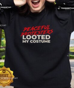 Premium peaceful protesters wearing looted costume sweatshirts at a vibrant demonstration for social justice.