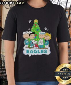 Alt Text: Premium Peanuts Characters X Philadelphia Eagles Christmas Ladies Tee featuring festive design for football fans.