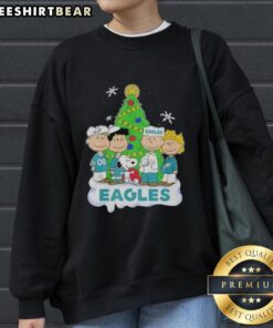 Premium Peanuts Characters X Philadelphia Eagles Christmas Sweatshirt featuring festive designs and team spirit.