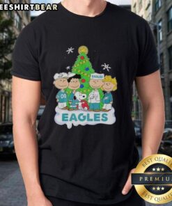 Premium Peanuts Characters X Philadelphia Eagles Christmas T-Shirt featuring festive designs for fans and holiday cheer.