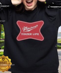 Premium Pittsburgh Yinzer Life sweatshirt featuring 'The Champagne of Cities' slogan in vibrant colors.