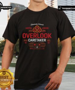 Premium Shining Hotel Lodge Estd 1909 Overlook Caretaker Since 1921 T-Shirt featuring vintage design and lodge logo.