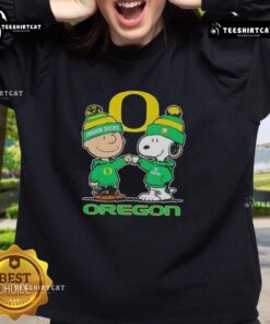 Premium Snoopy and Charlie Brown Oregon Ducks football skyline sweatshirt featuring vibrant graphics and cozy design.