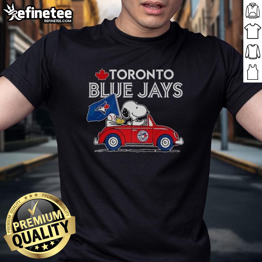 premium-snoopy-and-woodstock-on-volkswagen-beetle-x-toronto-blue-jays-baseball-fans-t-shirt Alt Text: Premium Snoopy and Woodstock on Volkswagen Beetle t-shirt for Toronto Blue Jays baseball fans, showcasing playful design.