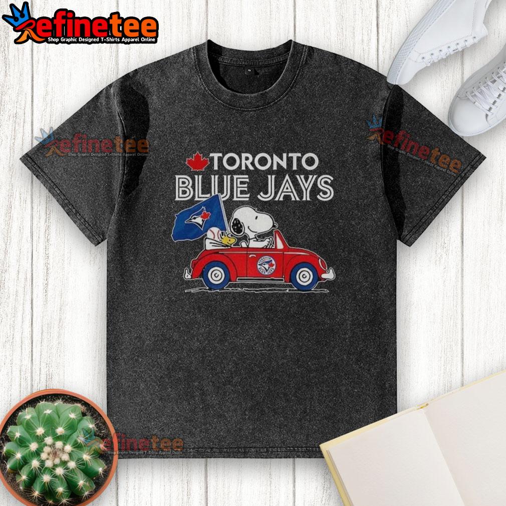premium-snoopy-and-woodstock-on-volkswagen-beetle-x-toronto-blue-jays-baseball-fans-washed-t-shirt Alt Text: Premium Snoopy and Woodstock on Volkswagen Beetle t-shirt for Toronto Blue Jays baseball fans, stylish and fun.